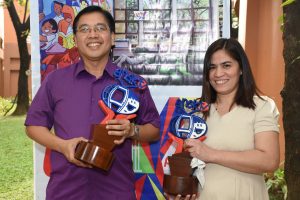 Dr. Carlos Tabunda Jr. is shown with his program director, Irma Abendan, as they hold the trophies symbolic of the two awards his programs over Net25 earned from the Anak TV Seal Awards.  (Photo by Ped Garcia) 