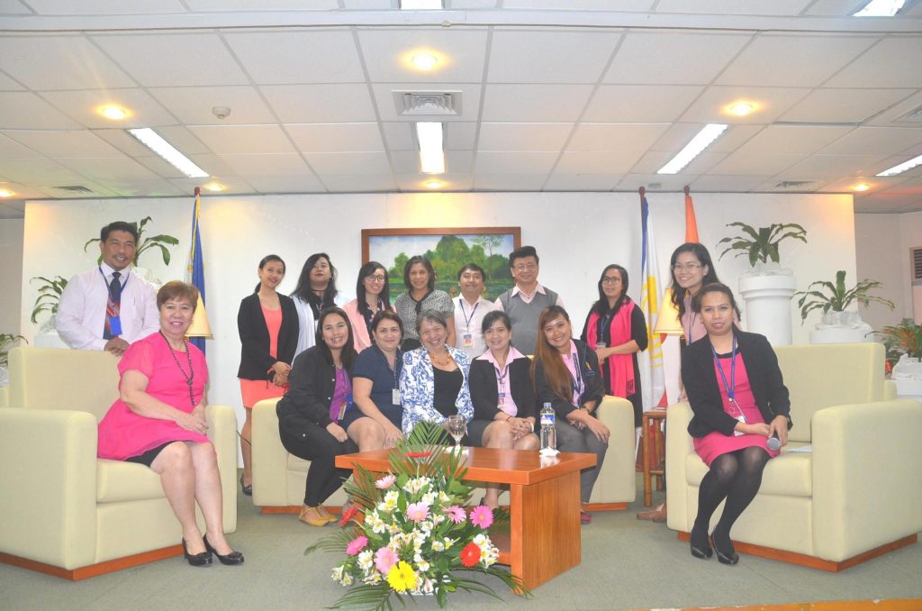 Dr. Margie Holmes (seated, center) poses for posterity with members of the GAD Focal Point Core Team led by HRMDD Managing Director Marife Magud (seated, left). The GDFPCT will lead the government research and training institution in monitoring all  gender-related programs and issues at the DAP.  (Photo by Megan Matias) 